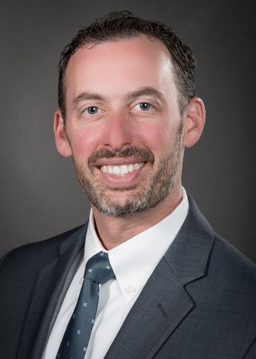 Michael Goldberg wearing a maroon tie